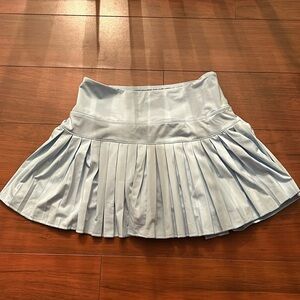 Women’s gold hinge skirt with shorts underneath size: S